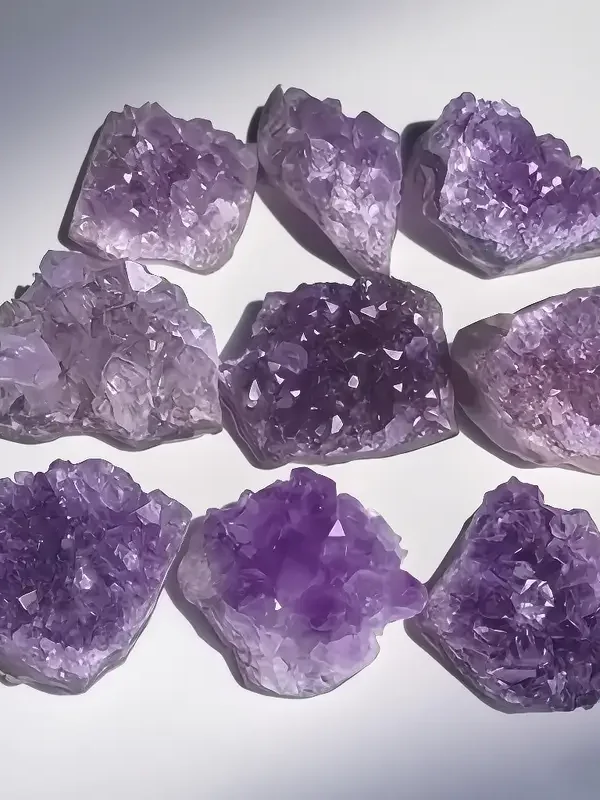 A close-up of ethically sourced Natural Amethyst Crystal Clusters showcasing rich purple shades and unique crystal formations. Ideal for energy healing, meditation, and as a captivating decor piece for home and office.