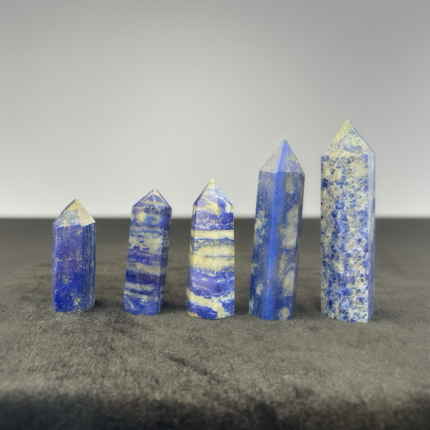 Exquisite lapis lazuli crystal tower with deep blue color and golden pyrite flecks, great for decor and spiritual practices